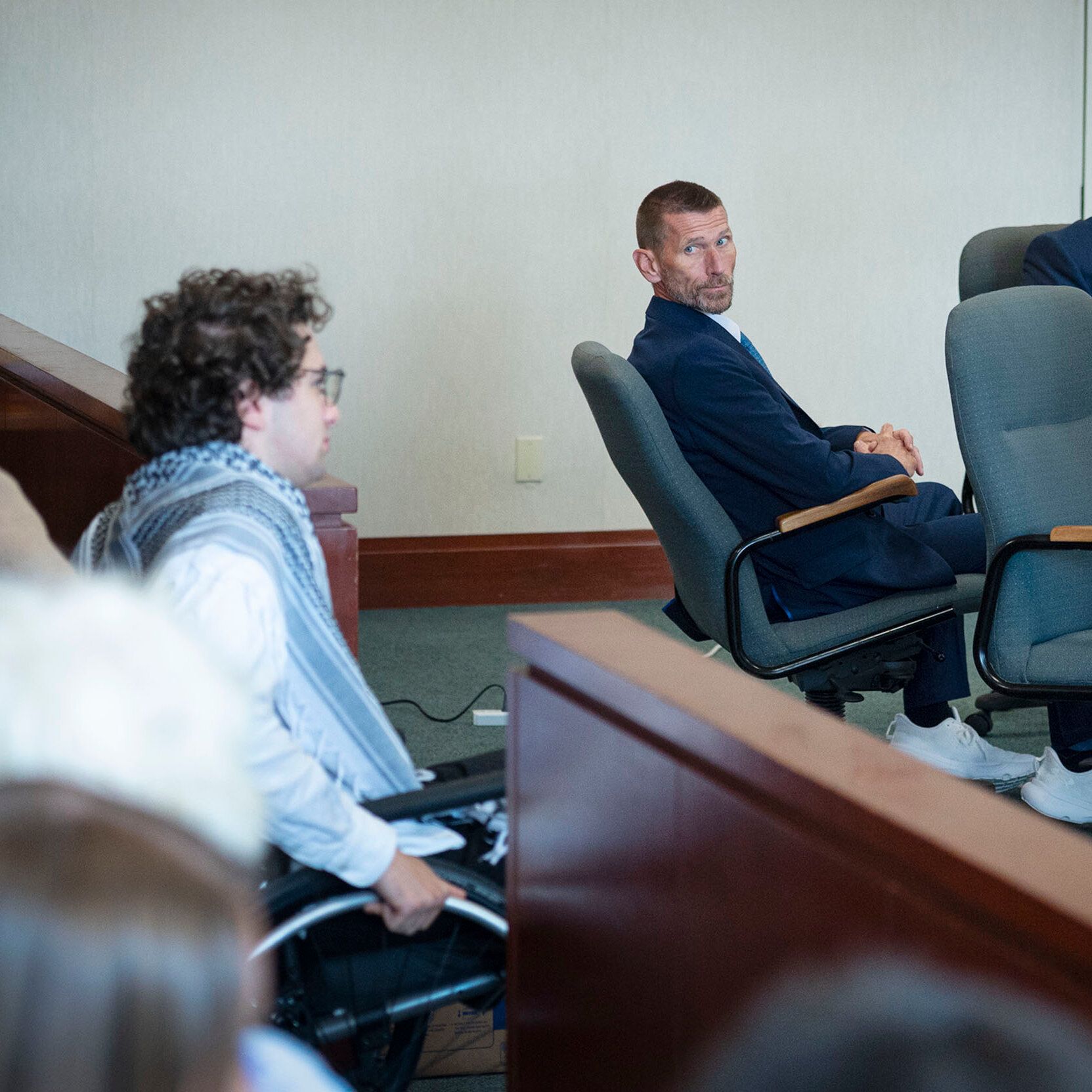 Jason Eaton watches as Hisham Awartani arrives to testify during the trial. - Todd Heisler/The New York Times