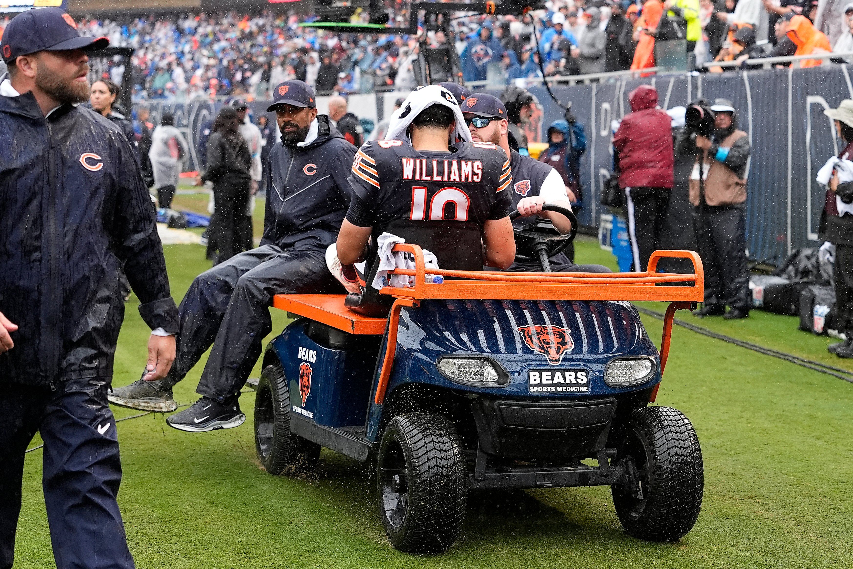 Caleb Williams is carted off after injuring his hamstring against the Minnesota Vikings at Soldier Field on September 20, 2026. - Patrick McDermott/Getty Images
