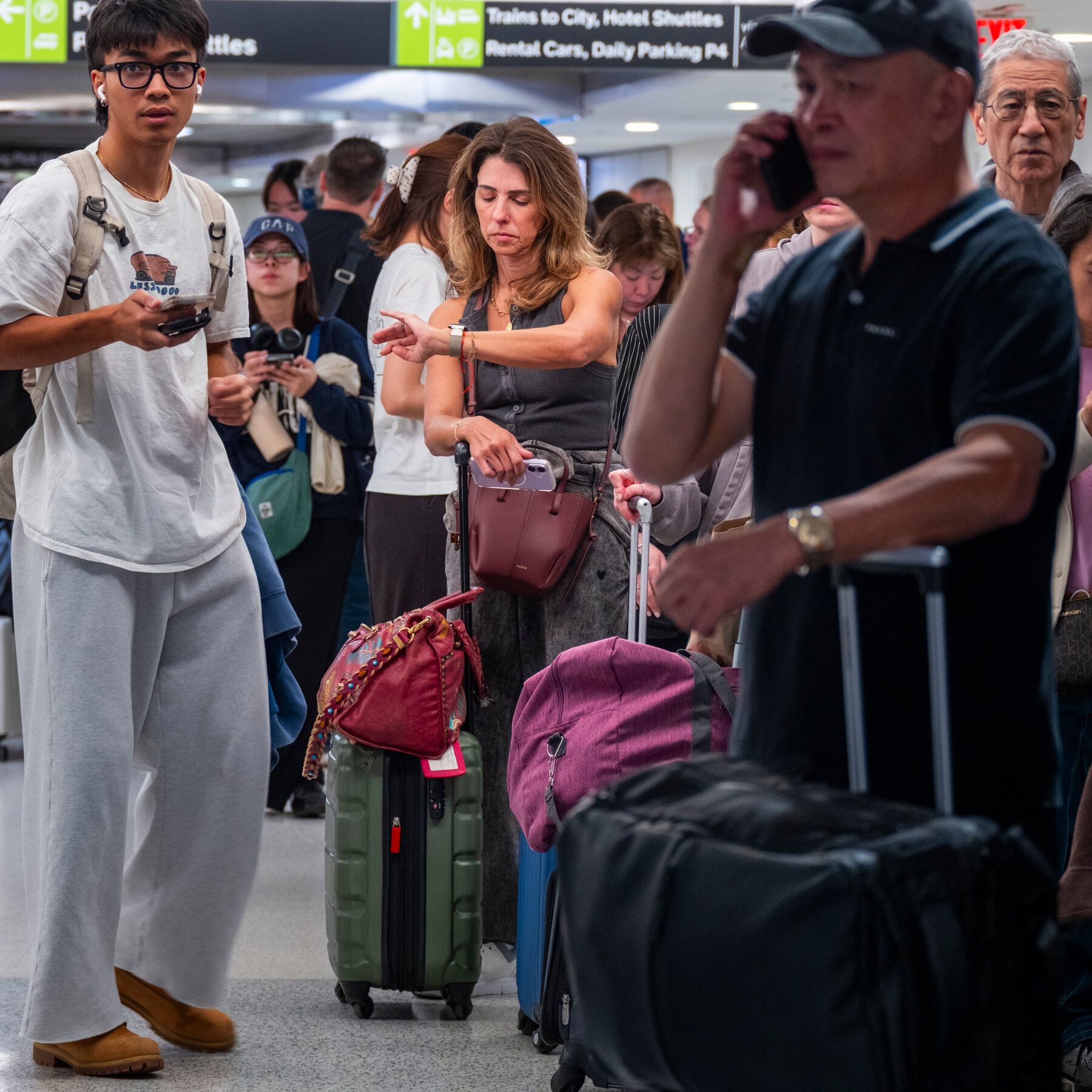Passengers stranded at Newark Liberty International Airport on Monday. - The New York Times