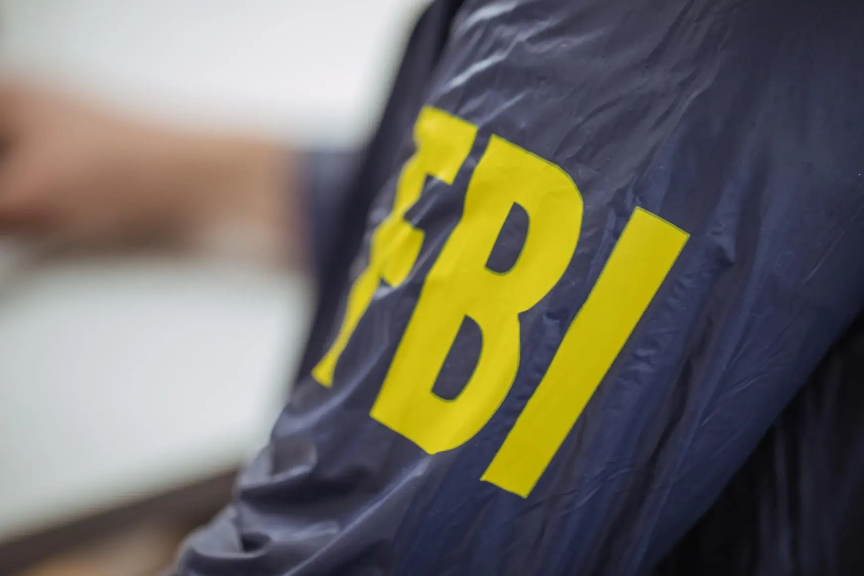 FBI agent wearing an FBI uniform - Dzelat / Shutterstock