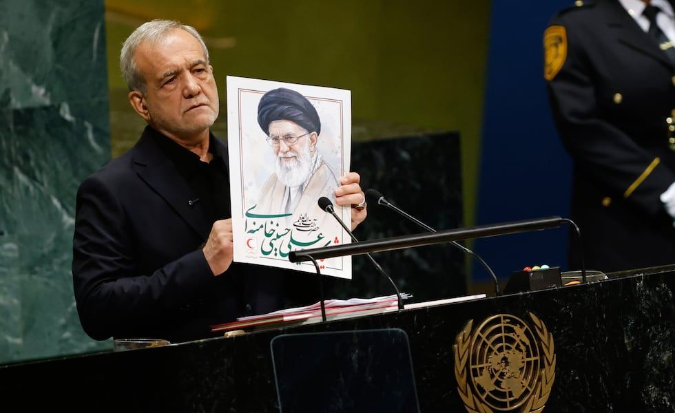 Iranian President Masoud Pezeshkian holds an image of late Supreme Leader Ayatollah Ali Khamenei during his U.N. General Assembly address, Sept. 23, 2026. - Stefan Jeremiah, Associated Press