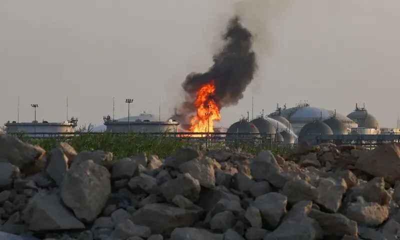 Flames burn at a facility belonging to Saudi oil giant Aramco south of Riyadh on October 3, 2026. - AFP